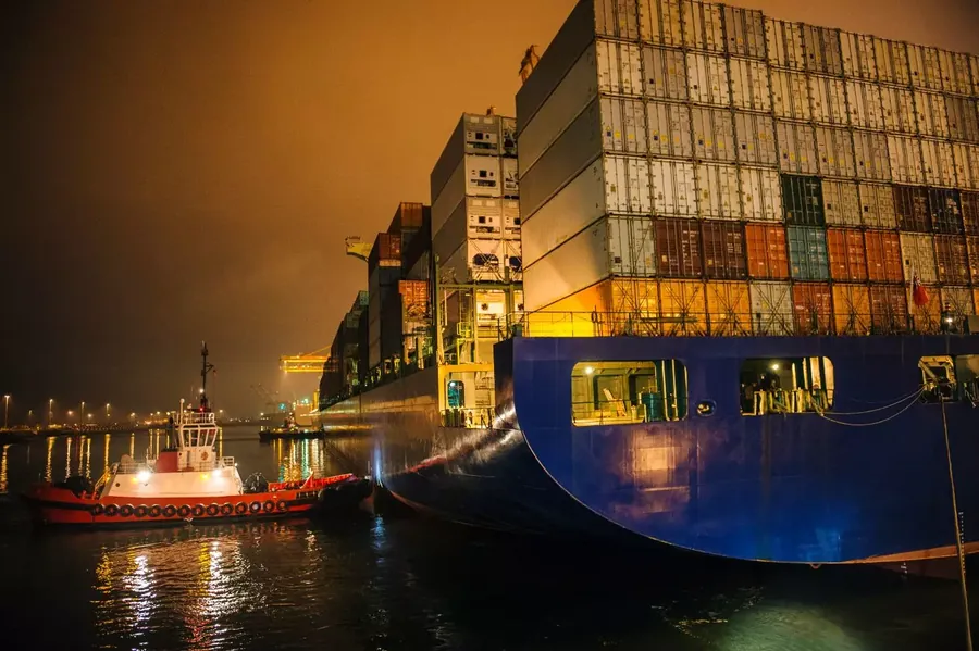 Container vessel at night in Dubai port